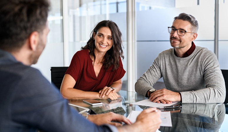 A couple talking to a financial adviser