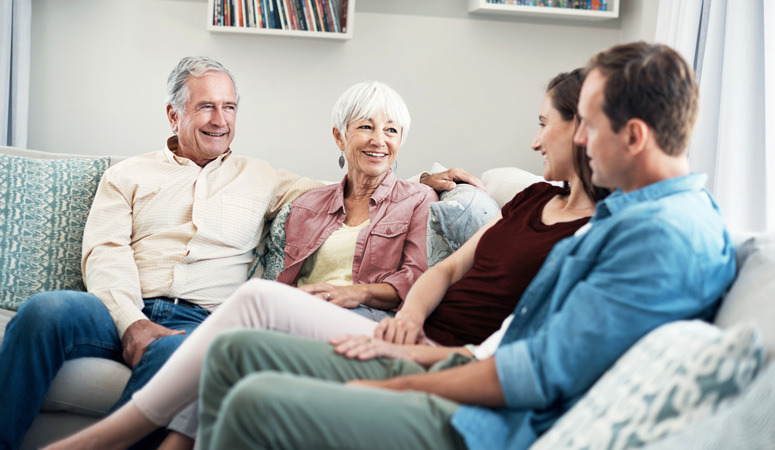 Elderly parents talking to their children