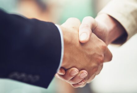 Two people shaking hands