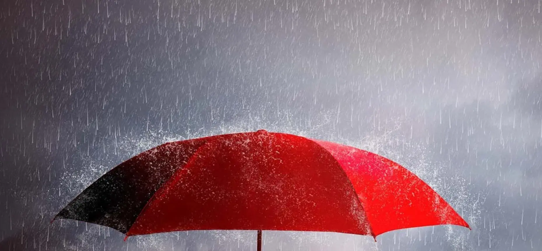 red umbrella in rain 